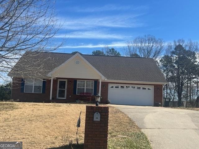 view of front facade with driveway and an attached garage