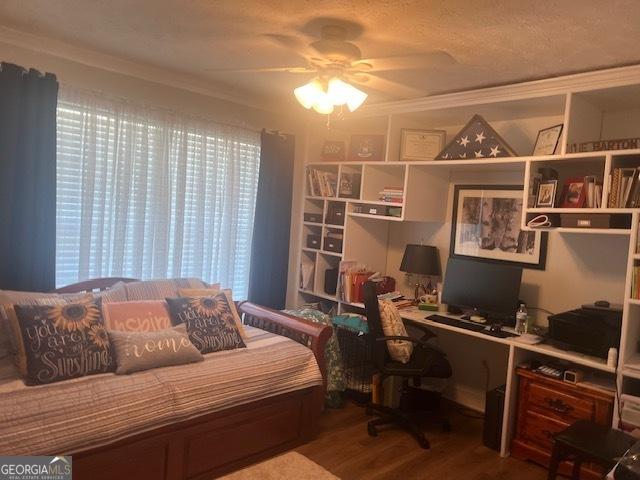 bedroom featuring wood finished floors