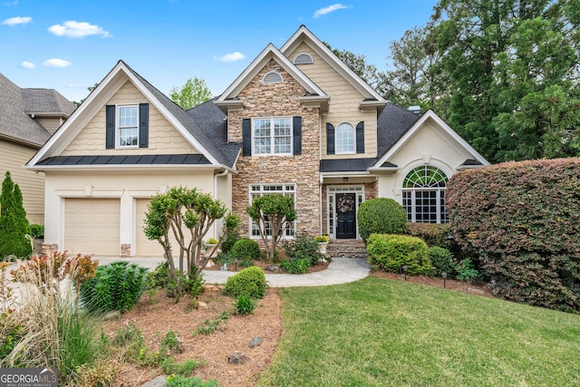 994 Fairview Club Cir, Dacula, GA 30019 - view of front facade with stucco siding, a standing seam roof, stone siding, a front yard, and a garage