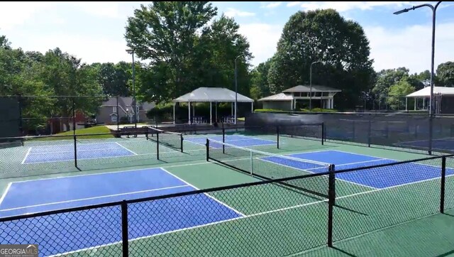 994 Fairview Club Cir, Dacula, GA 30019 - view of tennis court with community basketball court and fence