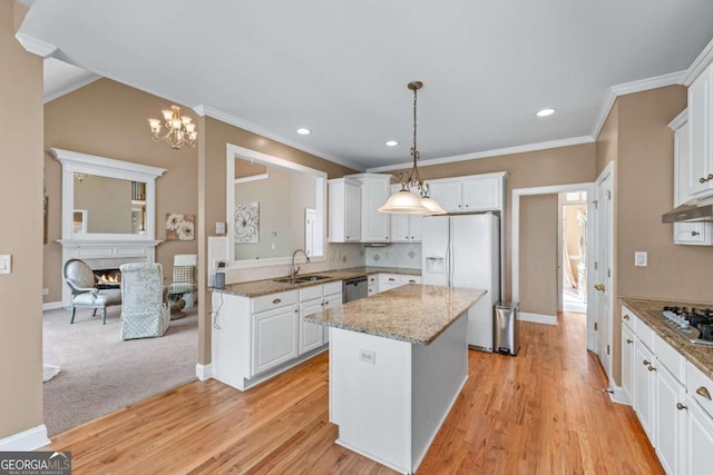994 Fairview Club Cir, Dacula, GA 30019 - kitchen with a center island, a sink, decorative light fixtures, white cabinets, and appliances with stainless steel finishes