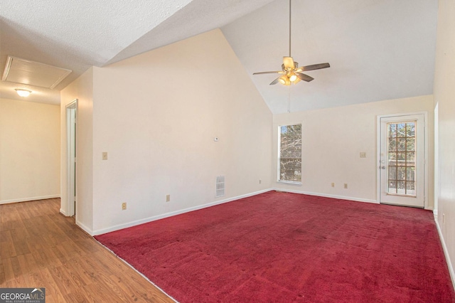 spare room with visible vents, baseboards, high vaulted ceiling, and ceiling fan