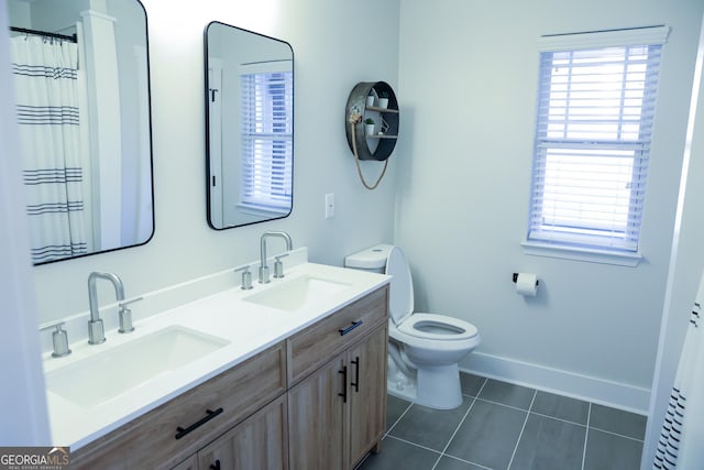 793 Round Tree Ct, Lawrenceville, GA 30045 - bathroom with tile patterned floors, toilet, baseboards, and a sink