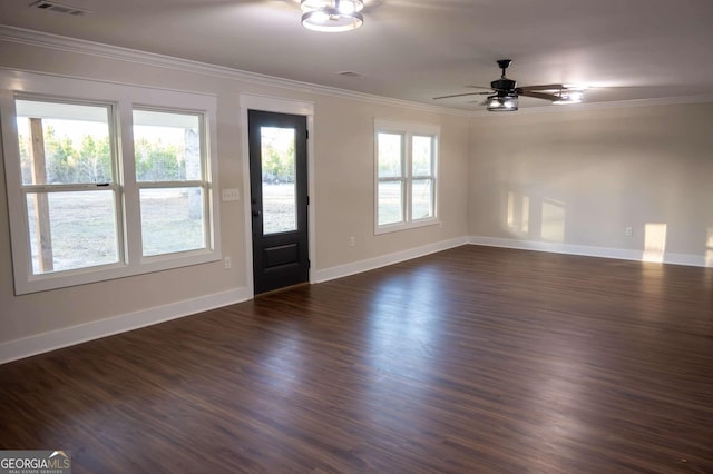 entrance foyer featuring dark wood-style floors, visible vents, ornamental molding, ceiling fan, and baseboards