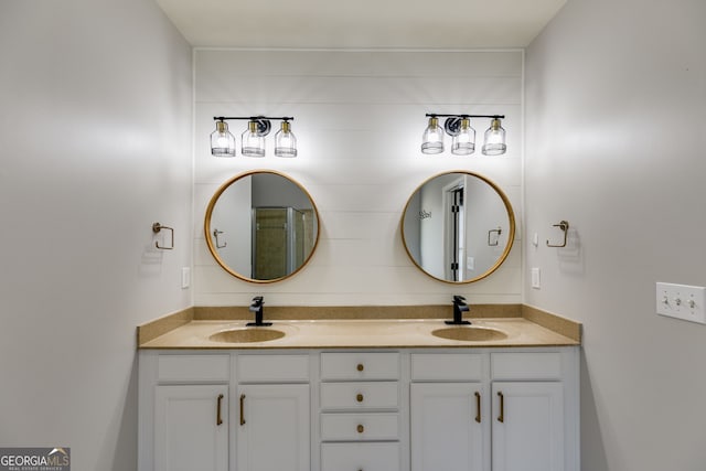 bathroom with double vanity and a sink