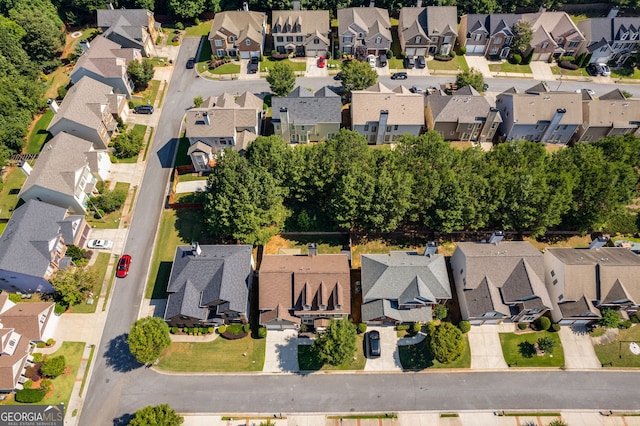 birds eye view of property with a residential view