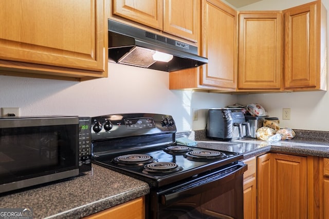 kitchen with stainless steel microwave, black range with electric cooktop, dark countertops, and under cabinet range hood