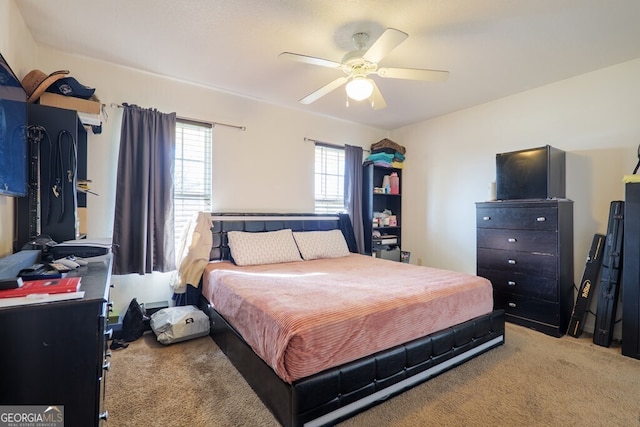 bedroom with light carpet and ceiling fan