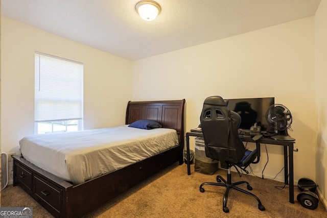 bedroom featuring carpet floors and baseboards