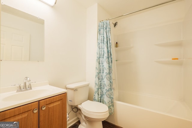 full bathroom with vanity, shower / bath combo with shower curtain, and toilet