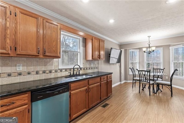 kitchen featuring dishwasher, brown cabinetry, and a sink