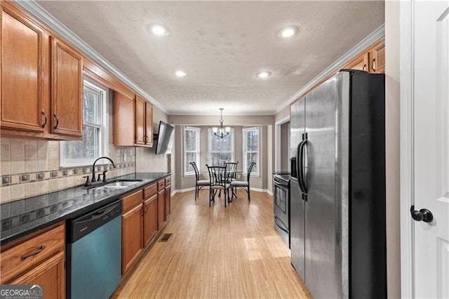 kitchen with dishwashing machine, a sink, refrigerator with ice dispenser, ornamental molding, and brown cabinetry