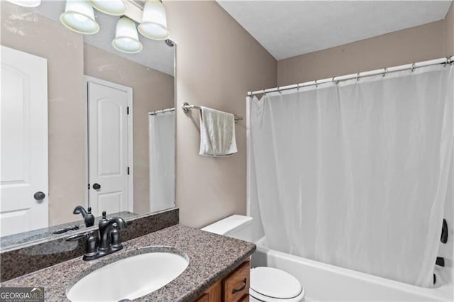 bathroom with toilet, shower / bath combination with curtain, and vanity