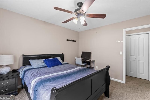 bedroom featuring light colored carpet, ceiling fan, and baseboards