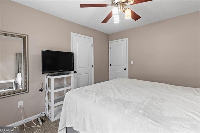 bedroom featuring carpet, a ceiling fan, and baseboards