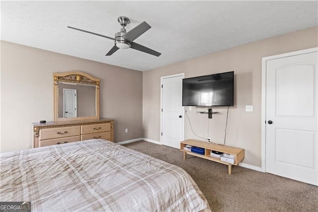 carpeted bedroom with a ceiling fan and baseboards