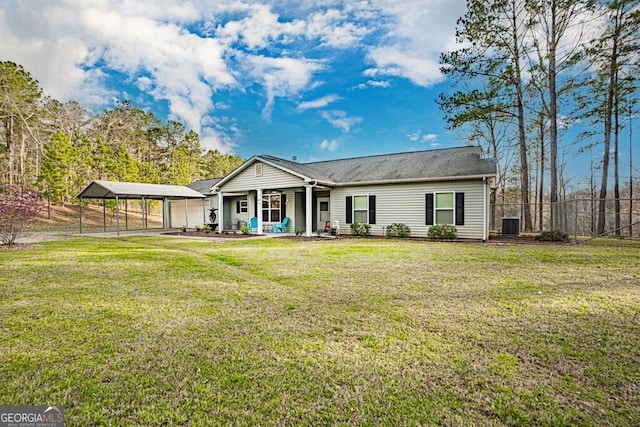 back of house featuring covered porch, a yard, central AC, and fence