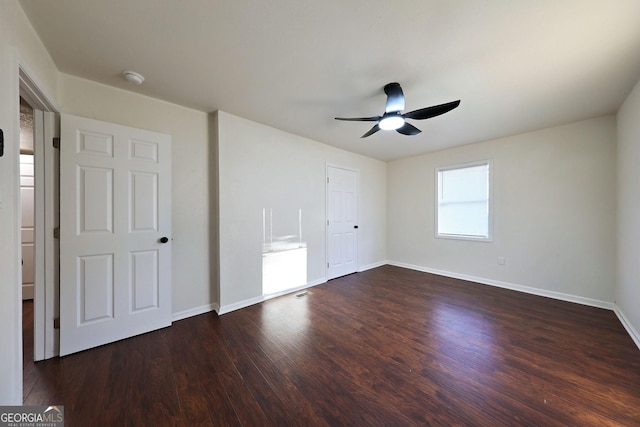 unfurnished bedroom featuring a ceiling fan, baseboards, and wood finished floors