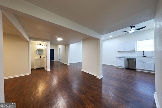 unfurnished living room featuring dark wood finished floors, recessed lighting, a sink, ceiling fan, and baseboards