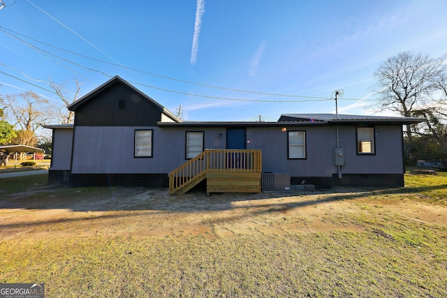 ranch-style home with metal roof and crawl space