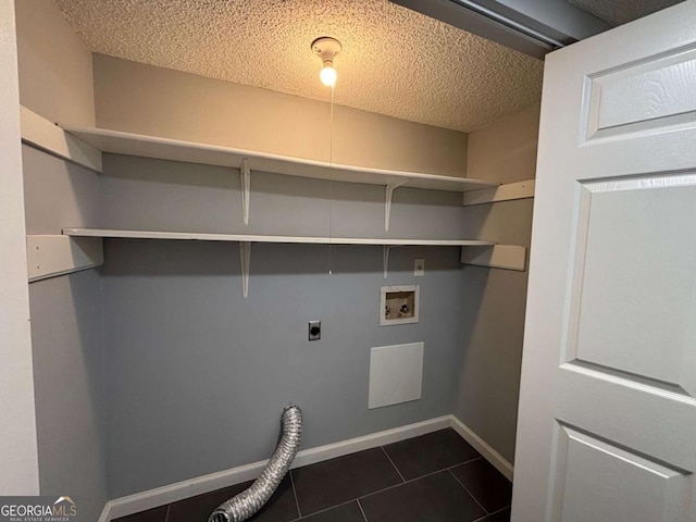 laundry room with laundry area, baseboards, hookup for a washing machine, a textured ceiling, and hookup for an electric dryer