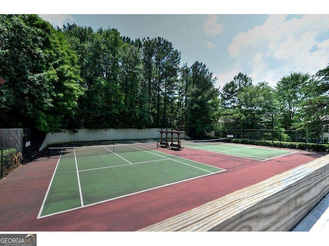 view of sport court with fence