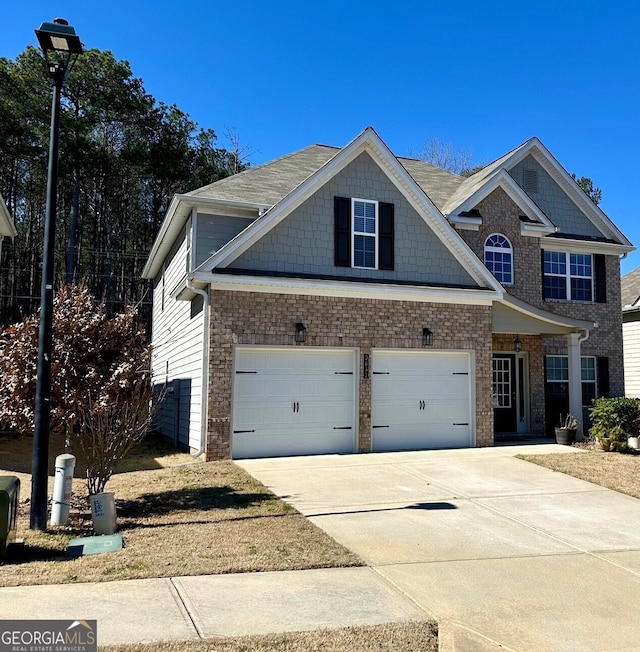 view of front of home with concrete driveway, brick siding, and a garage