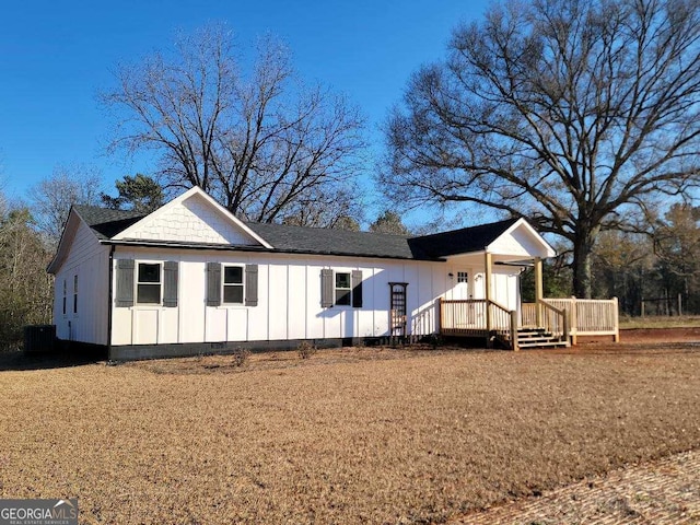 view of front facade featuring board and batten siding, crawl space, and a deck