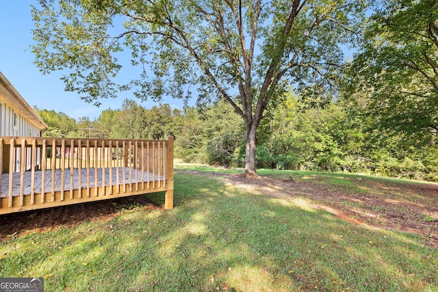 view of yard featuring a wooden deck