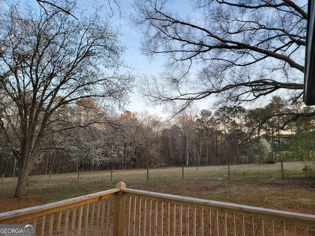 view of yard featuring a forest view