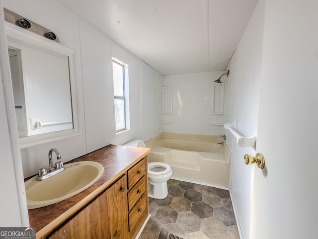 full bathroom featuring toilet, shower / bathing tub combination, and vanity