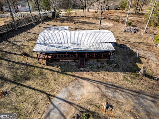 view of yard featuring an outdoor structure and fence