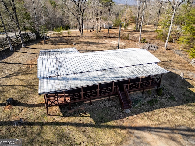 exterior space with fence and an outdoor structure