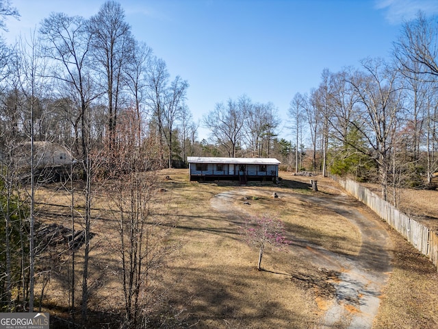 view of front of property featuring fence