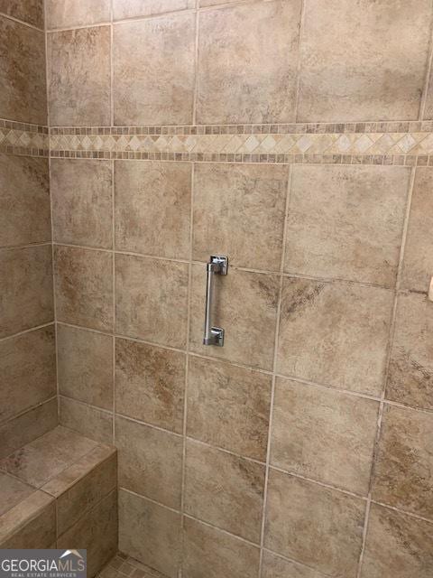 details with a tile shower