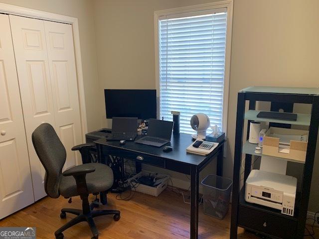 office space with wood finished floors