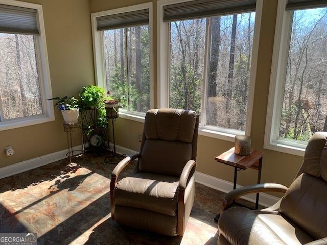 sitting room featuring baseboards