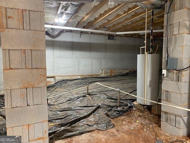 below grade area featuring water heater and crawl space