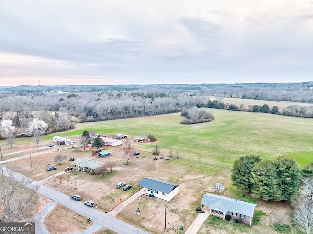 birds eye view of property featuring a rural view