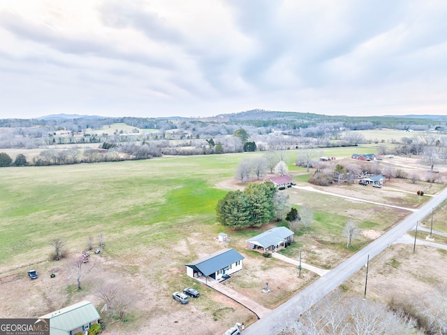 birds eye view of property featuring a rural view