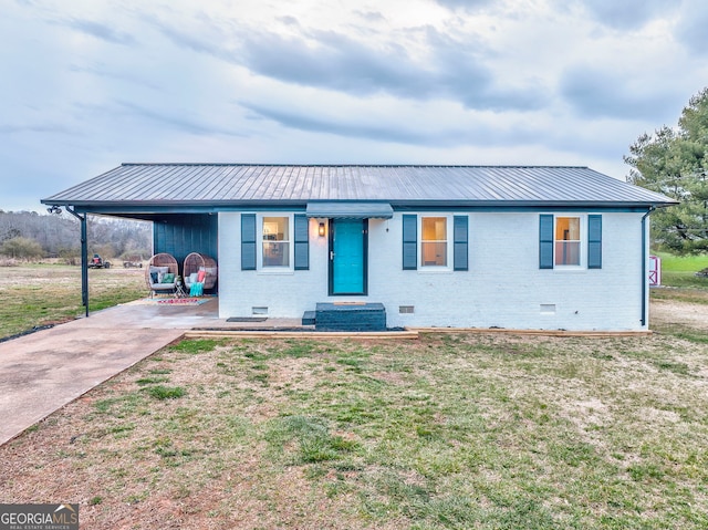 view of front of house featuring a front lawn, a carport, metal roof, crawl space, and brick siding