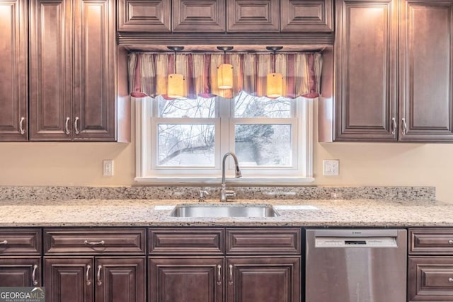 kitchen with a wealth of natural light, dishwasher, a sink, and dark brown cabinets