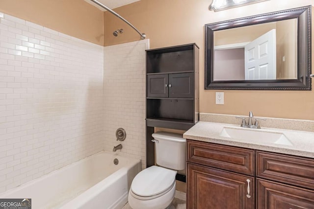 bathroom featuring vanity, toilet, and shower / bathtub combination