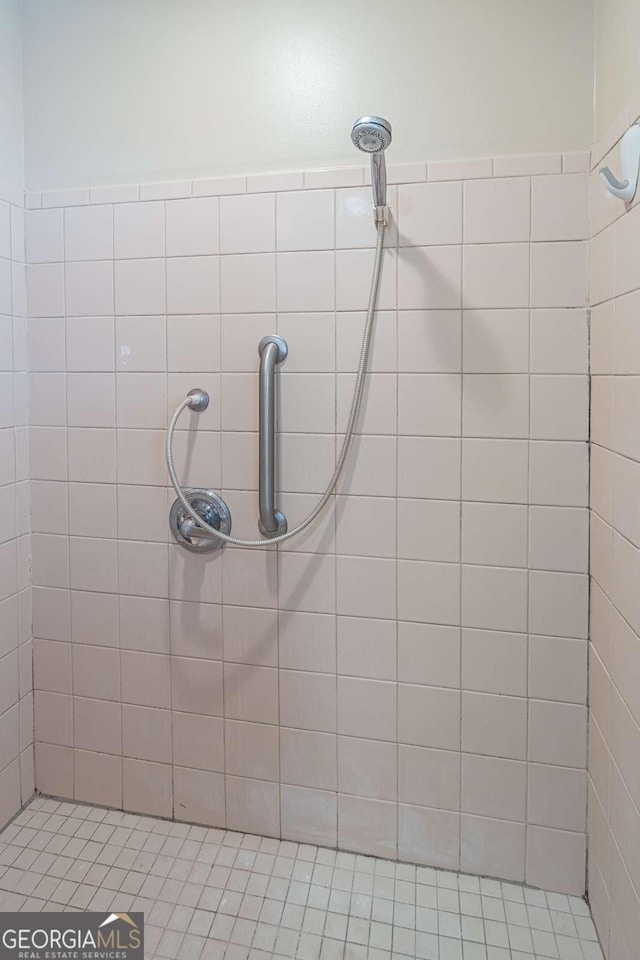 full bathroom with tiled shower