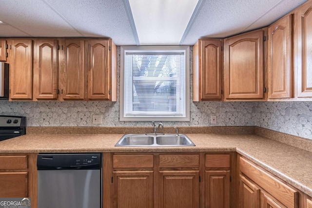 kitchen featuring range with electric stovetop, a sink, light countertops, stainless steel dishwasher, and brown cabinetry