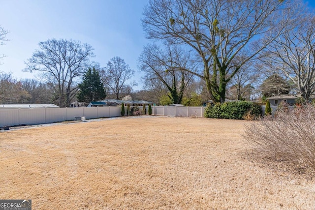 view of yard featuring a fenced backyard