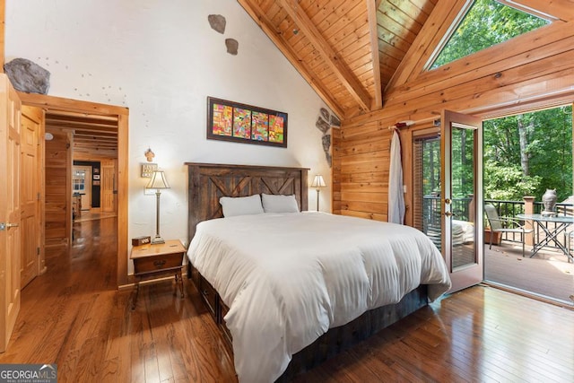 bedroom featuring access to exterior, beamed ceiling, high vaulted ceiling, and hardwood / wood-style floors