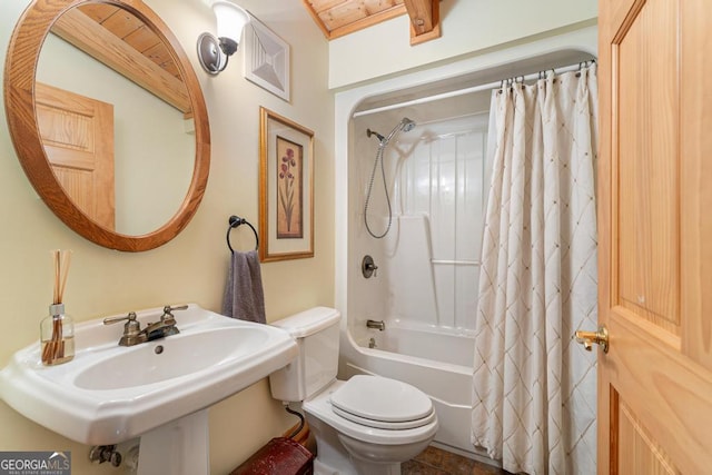 bathroom featuring visible vents, toilet, and shower / tub combo with curtain