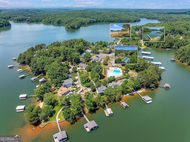 aerial view with a water view and a wooded view