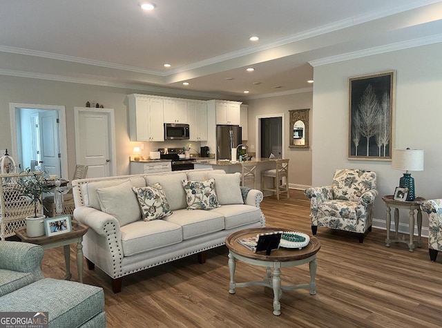 living area featuring baseboards, dark wood finished floors, crown molding, and recessed lighting